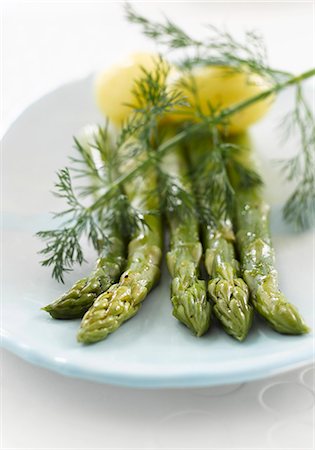 Four spears of green asparagus with potatoes and dill Stock Photo - Premium Royalty-Free, Code: 659-03521927