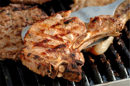 porkchop - Pork chop on barbecue Stock Photo - Premium Royalty-Free, Code: 659-03521964