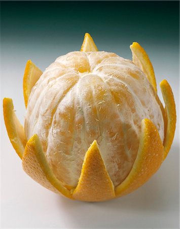 An orange, half-peeled Stock Photo - Premium Royalty-Free, Code: 659-03522117