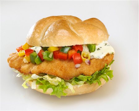 single sandwich - Escalope, salad, diced peppers and remoulade in bread roll Stock Photo - Premium Royalty-Free, Code: 659-03522242