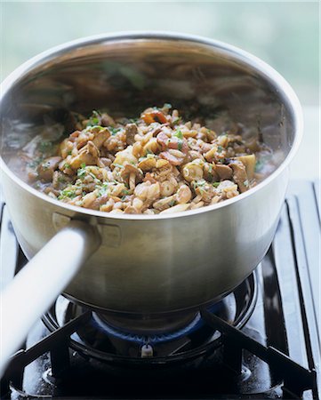 simmering - Making mushroom risotto in a pan Stock Photo - Premium Royalty-Free, Code: 659-03522377