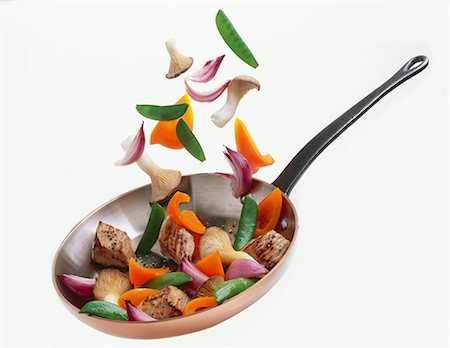 saute - Pork and vegetables in a frying pan Foto de stock - Sin royalties Premium, Código: 659-03522404