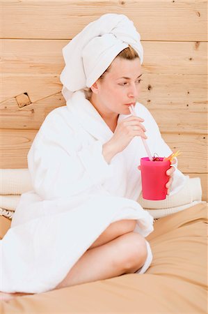 sauna wellness - Woman in bathrobe drinking fruit cocktail Stock Photo - Premium Royalty-Free, Code: 659-03522519