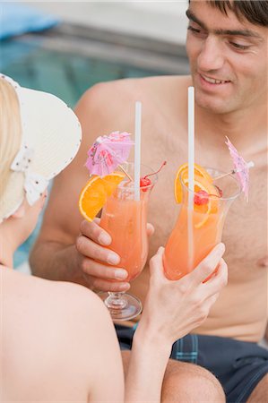simsearch:659-03535770,k - Man and woman with Planter's Punch by pool Stock Photo - Premium Royalty-Free, Code: 659-03522552