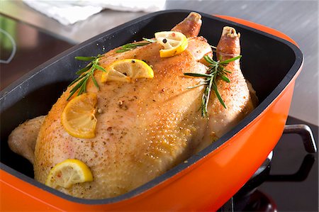 roasting pan - Roast chicken with rosemary and lemon Stock Photo - Premium Royalty-Free, Code: 659-03522624