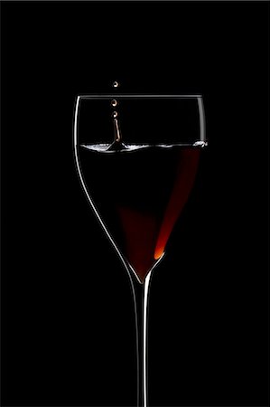 Red wine dripping into a wine glass Stock Photo - Premium Royalty-Free, Code: 659-03522702