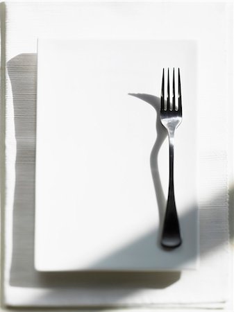 platter - A fork on a white platter Stock Photo - Premium Royalty-Free, Code: 659-03522997