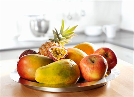 exotic fruit bowl - Dish of fruit (apple, pineapple, papaya, mango, passion fruit) Stock Photo - Premium Royalty-Free, Code: 659-03523054