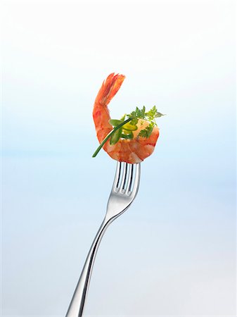 Prawn and herbs on a fork Stock Photo - Premium Royalty-Free, Code: 659-03523107