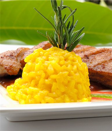 simsearch:659-01845981,k - Saffron risotto served with roast duck breast Stock Photo - Premium Royalty-Free, Code: 659-03523135