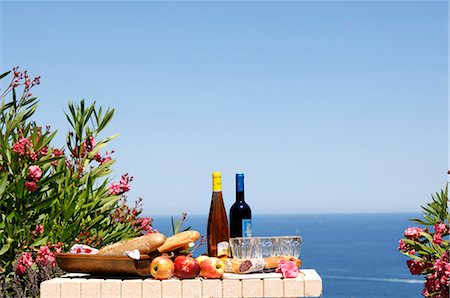 salami - Laid garden table with sea view Stock Photo - Premium Royalty-Free, Code: 659-03523171
