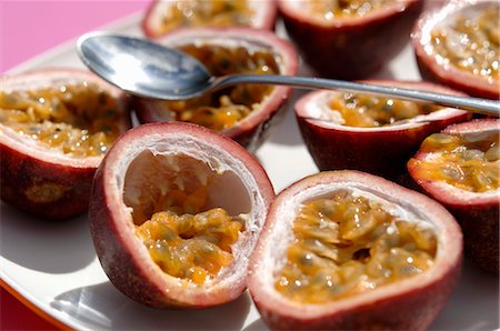 passion fruit - Halved passion fruits with spoon Stock Photo - Premium Royalty-Free, Code: 659-03523186