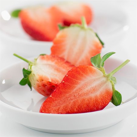 simsearch:659-01866279,k - Halved strawberries in small white dishes Stock Photo - Premium Royalty-Free, Code: 659-03523464