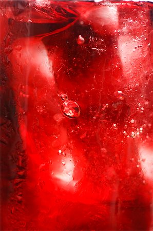 Red fruit juice with ice cubes, full-frame Stock Photo - Premium Royalty-Free, Code: 659-03523576