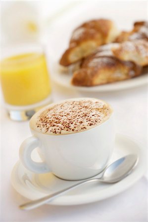 A cup of cappuccino, orange juice and brioches Stock Photo - Premium Royalty-Free, Code: 659-03523674