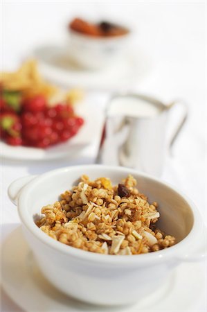 Muesli, a small jug of milk and fresh fruit Stock Photo - Premium Royalty-Free, Code: 659-03523677