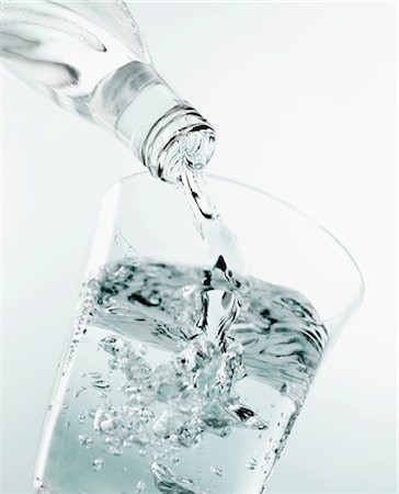 Pouring a glass of water Stock Photo - Premium Royalty-Free, Code: 659-03523714