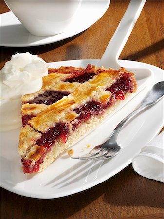 simsearch:659-01850805,k - A piece of Linzer torte with whipped cream Stock Photo - Premium Royalty-Free, Code: 659-03523736