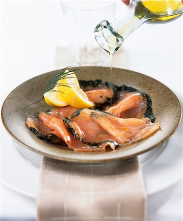 fish with olive oil - Sprinkling gravlax with olive oil Stock Photo - Premium Royalty-Free, Code: 659-03523985