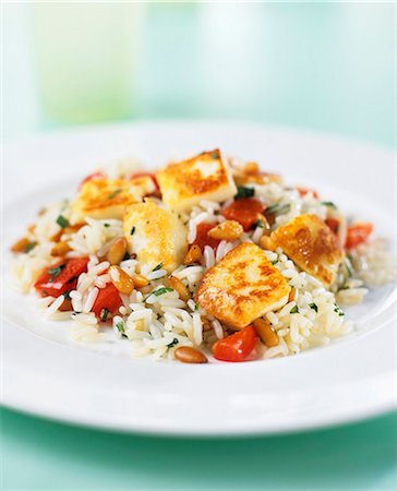 rice dish - Fried, diced chicken breast on rice with tomatoes Stock Photo - Premium Royalty-Free, Code: 659-03523993