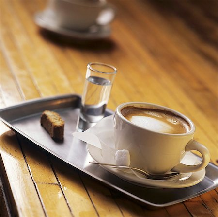 Cappuccino and grappa on tray Stock Photo - Premium Royalty-Free, Code: 659-03534183