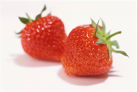 strawberries white background nobody - Two strawberries Stock Photo - Premium Royalty-Free, Code: 659-03534339