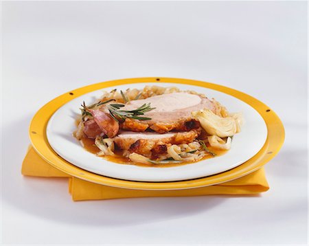 simsearch:659-03534175,k - Two slices of roast pork with crackling on plate Stock Photo - Premium Royalty-Free, Code: 659-03534438