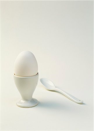 simsearch:659-01850865,k - A boiled white egg in an egg cup with plastic spoon Stock Photo - Premium Royalty-Free, Code: 659-03534638