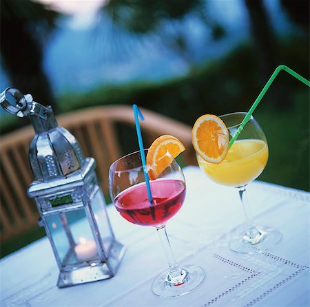 Two different juices in glasses on table at twilight Stock Photo - Premium Royalty-Free, Code: 659-03534742