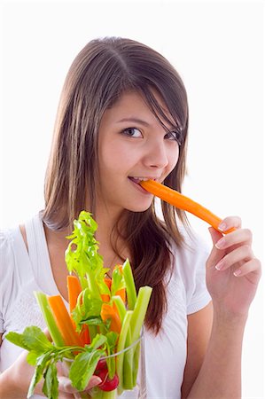 simsearch:659-06151776,k - Girl biting into a fresh carrot Foto de stock - Sin royalties Premium, Código: 659-03534787