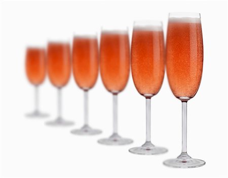Several glasses of rosÈ sparkling wine in a row Stock Photo - Premium Royalty-Free, Code: 659-03534894