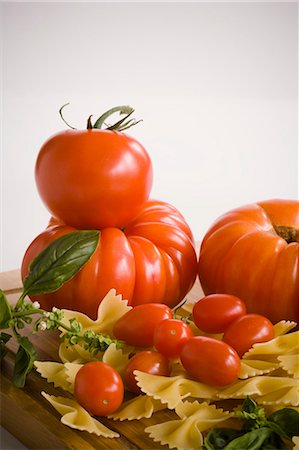 food still life - Various Tomatoes with Pasta and Basil Stock Photo - Premium Royalty-Free, Code: 659-03535107