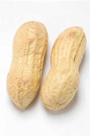 erdnuss - Two unshelled peanuts Foto de stock - Sin royalties Premium, Código: 659-03535114