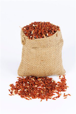 Whole-grain red rice (Oryza sativa) Stock Photo - Premium Royalty-Free, Code: 659-03535134