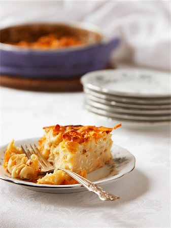 pasta gratin - Slice of Baked Macaroni and Cheese on a Plate Stock Photo - Premium Royalty-Free, Code: 659-03535144