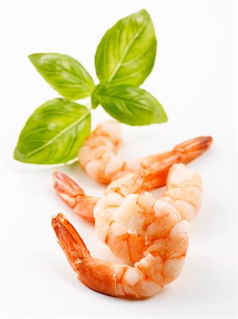 prawn dishes - Four peeled prawns with basil Stock Photo - Premium Royalty-Free, Code: 659-03535314