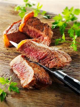 steak chunk - Beef steak, cut into slices Stock Photo - Premium Royalty-Free, Code: 659-03535545