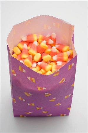 Candy corn in paper bag Stock Photo - Premium Royalty-Free, Code: 659-03535650