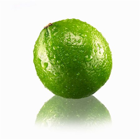 Lime with drops of water and reflection Stock Photo - Premium Royalty-Free, Code: 659-03535880