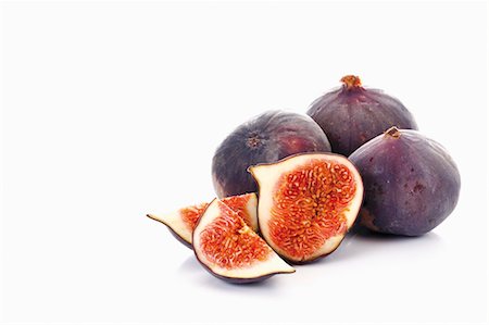 fig - Fresh figs, whole and halved Stock Photo - Premium Royalty-Free, Code: 659-03535910