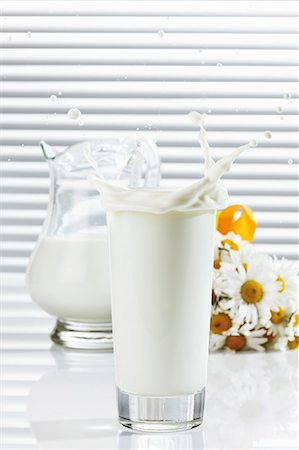 Milk splashing out of glass Stock Photo - Premium Royalty-Free, Code: 659-03535983