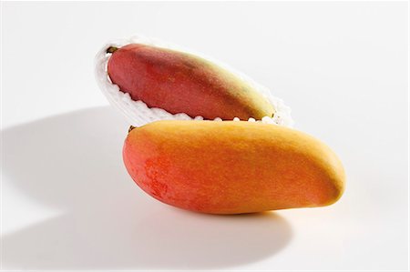 Two mangos from Thailand Stock Photo - Premium Royalty-Free, Code: 659-03535991