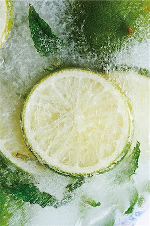 frozen food - Limes in block of ice (close-up) Foto de stock - Sin royalties Premium, Código: 659-03536017