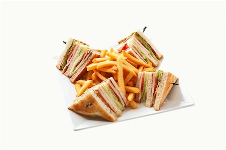 sándwich club - Toasted sandwiches (triangles) with chips Foto de stock - Sin royalties Premium, Código: 659-03536042