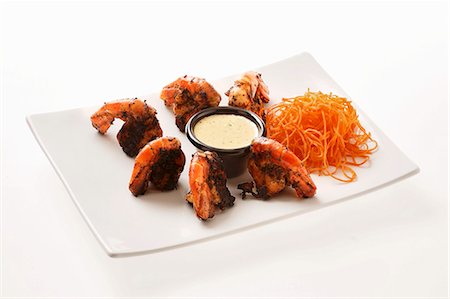 Slightly burnt prawns with carrots and dip Stock Photo - Premium Royalty-Free, Code: 659-03536081