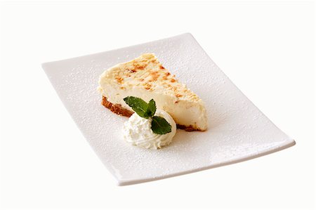 A piece of cheesecake Foto de stock - Sin royalties Premium, Código: 659-03536108