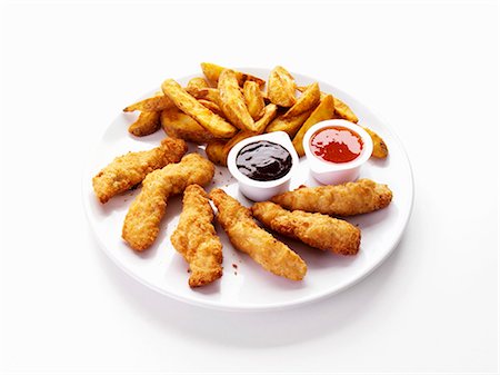 Doigts de poulet et de quartiers de pommes de terre avec trempette Photographie de stock - Premium Libres de Droits, Code: 659-03536163