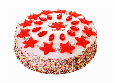 Gâteau décoré de paillettes et de bonbons jelly Photographie de stock - Premium Libres de Droits, Code: 659-03536229