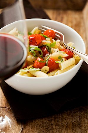 simsearch:659-06903446,k - Penne with cherry tomatoes, basil and garlic Stock Photo - Premium Royalty-Free, Code: 659-03536272