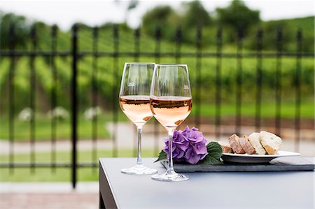 roses background - Two glasses of rosÈ wine, vineyard in background Stock Photo - Premium Royalty-Free, Code: 659-03536310
